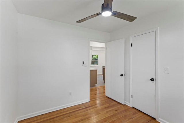 8918 Switzer St, Overland Park, KS 66214 - unfurnished bedroom featuring light wood-style flooring and ceiling fan