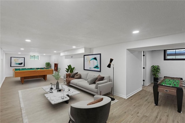 8918 Switzer St, Overland Park, KS 66214 - recreation room featuring billiards table, light wood-style floors, recessed lighting, a textured ceiling, and healthy amount of natural light