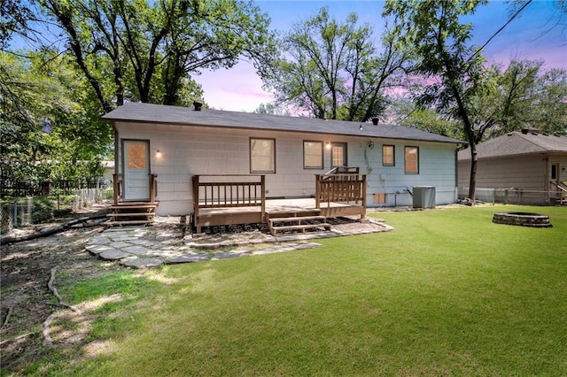 8918 Switzer St, Overland Park, KS 66214 - back of house with a fire pit and a wooden deck
