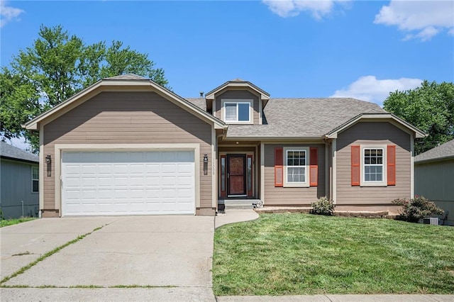 19208 E Lynchburg Pl, Independence, MO 64058 - view of front facade with concrete driveway, a front yard, an attached garage, and roof with shingles