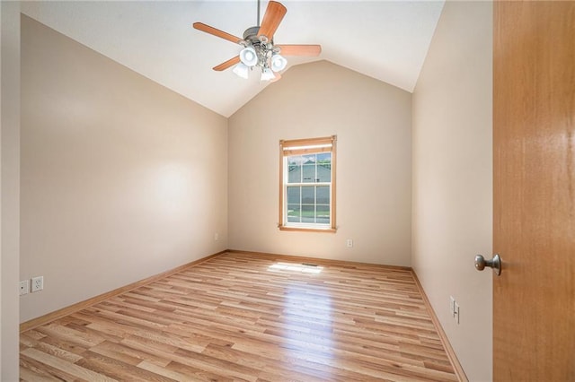 19208 E Lynchburg Pl, Independence, MO 64058 - spare room with a ceiling fan, light wood-style flooring, and vaulted ceiling
