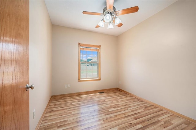 19208 E Lynchburg Pl, Independence, MO 64058 - spare room with wood finished floors and ceiling fan