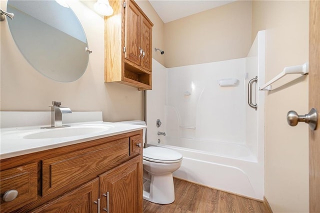 19208 E Lynchburg Pl, Independence, MO 64058 - bathroom with vanity, wood finished floors, and  shower combination