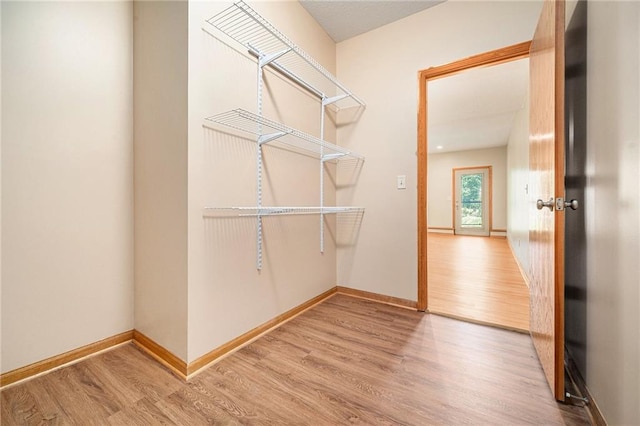 19208 E Lynchburg Pl, Independence, MO 64058 - spacious closet with wood finished floors