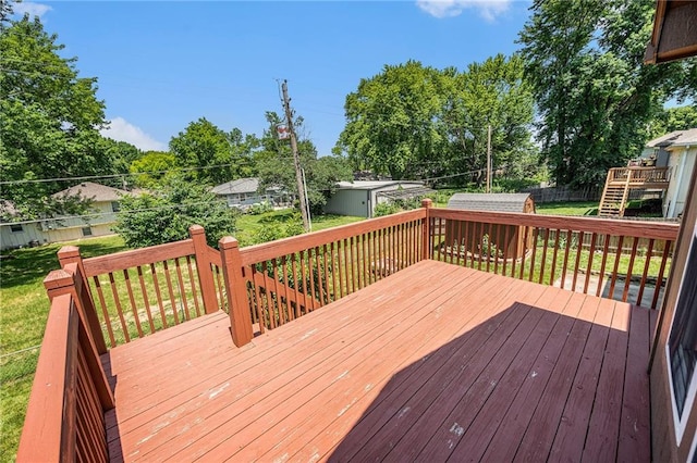 19208 E Lynchburg Pl, Independence, MO 64058 - wooden terrace with an outdoor structure and view of wooded area