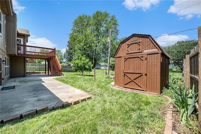 19208 E Lynchburg Pl, Independence, MO 64058 - view of yard featuring stairs, a storage unit, a patio area, and a deck