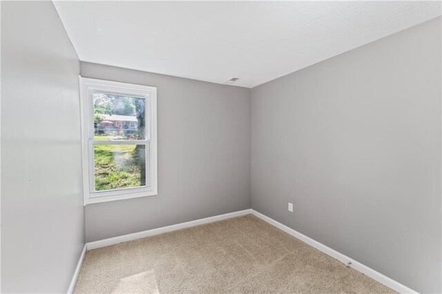 5513 Hardy Ave, Raytown, MO 64133 - carpeted empty room with baseboards