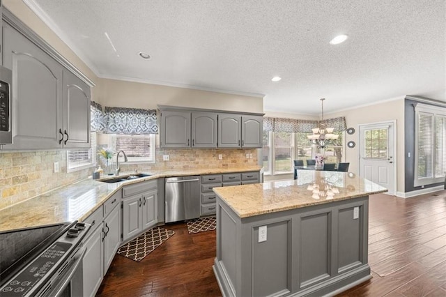 11927 W 131st Ter, Overland Park, KS 66213 - kitchen featuring appliances with stainless steel finishes, gray cabinets, a textured ceiling, a chandelier, and a center island