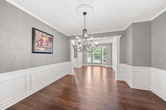 11927 W 131st Ter, Overland Park, KS 66213 - unfurnished dining area with a chandelier, dark wood-style flooring, ornamental molding, a wainscoted wall, and a decorative wall