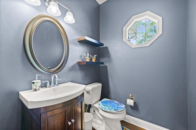 11927 W 131st Ter, Overland Park, KS 66213 - half bathroom featuring vanity and wood finished floors