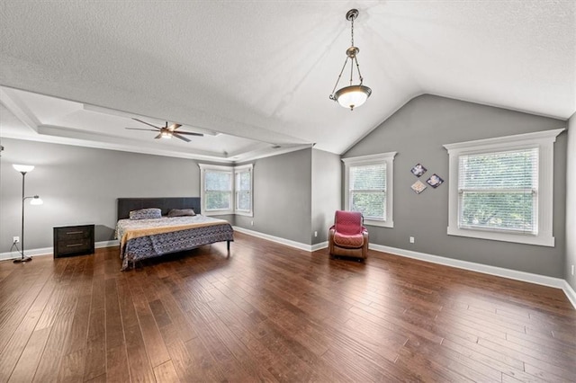 11927 W 131st Ter, Overland Park, KS 66213 - bedroom with hardwood / wood-style floors, multiple windows, a textured ceiling, and vaulted ceiling