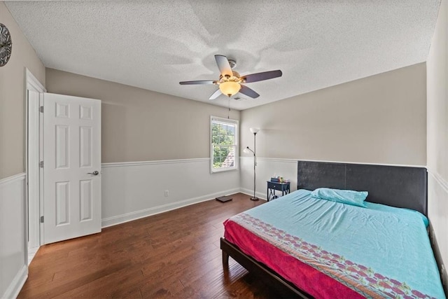 11927 W 131st Ter, Overland Park, KS 66213 - bedroom with wood finished floors, a textured ceiling, and ceiling fan