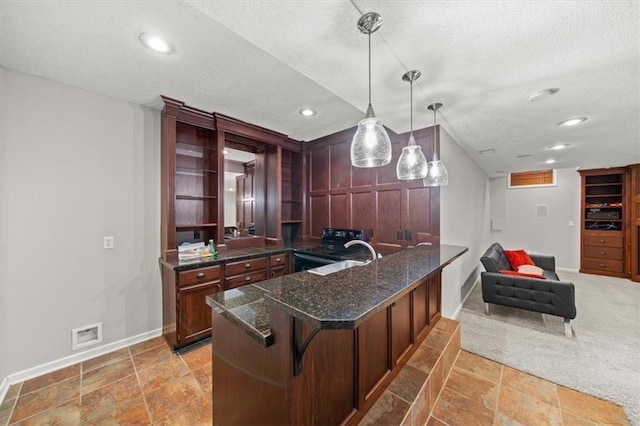 11927 W 131st Ter, Overland Park, KS 66213 - kitchen with a textured ceiling, open shelves, a peninsula, decorative light fixtures, and recessed lighting