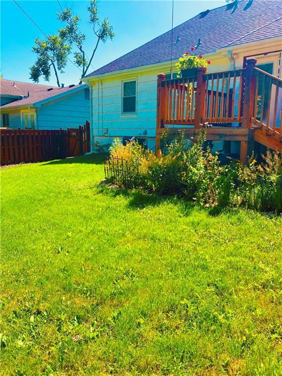 7909 Appleton Ave, Raytown, MO 64138 - back of house featuring roof with shingles and a deck