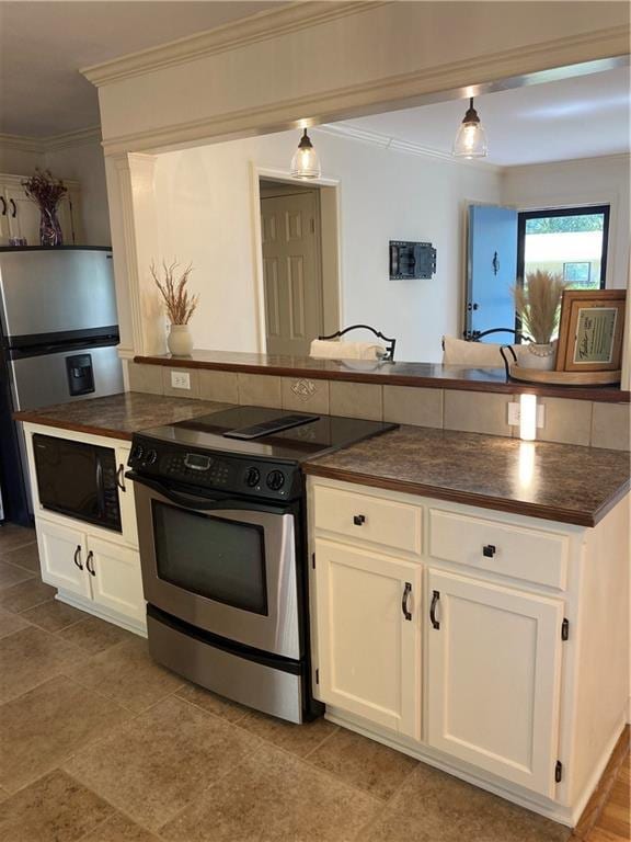 7909 Appleton Ave, Raytown, MO 64138 - kitchen with electric range, dark countertops, built in microwave, ornamental molding, and white cabinets
