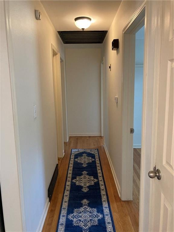 7909 Appleton Ave, Raytown, MO 64138 - corridor with light wood-style flooring and baseboards