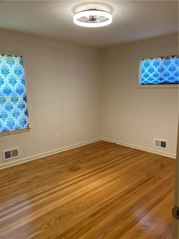 7909 Appleton Ave, Raytown, MO 64138 - spare room with light wood-style floors and baseboards