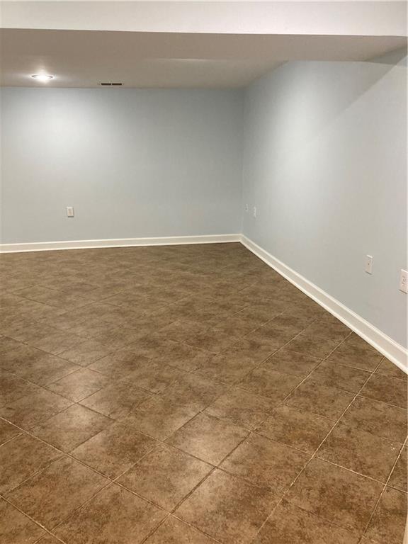 7909 Appleton Ave, Raytown, MO 64138 - empty room featuring baseboards and recessed lighting