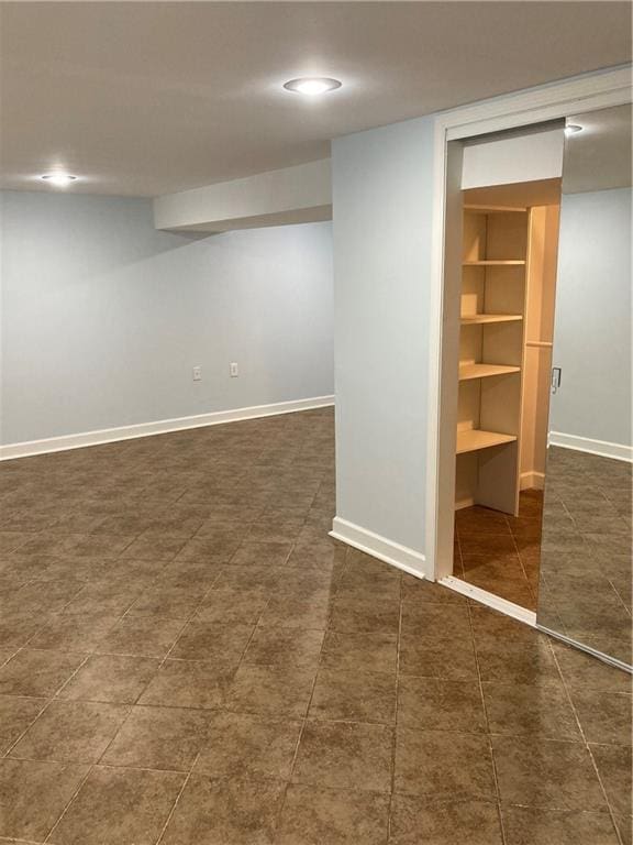 7909 Appleton Ave, Raytown, MO 64138 - finished below grade area featuring recessed lighting and dark tile patterned floors