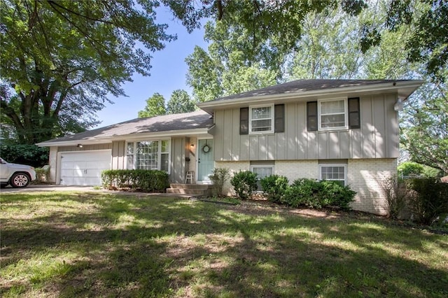 12508 Valley Brook Dr, Grandview, MO 64030 - tri-level home with board and batten siding, an attached garage, brick siding, and a front yard