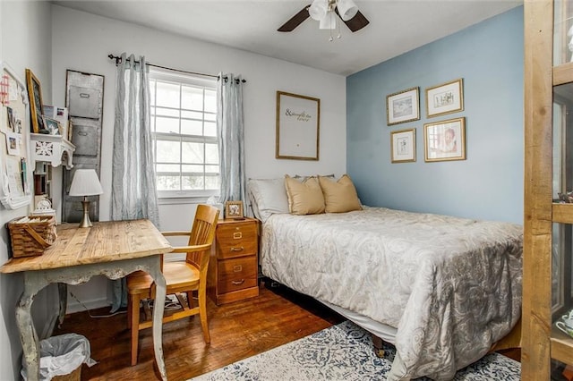 12508 Valley Brook Dr, Grandview, MO 64030 - bedroom featuring wood finished floors, ceiling fan, and a desk