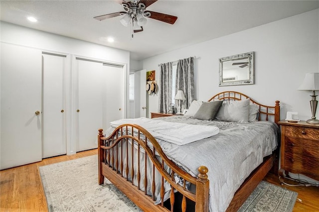 12508 Valley Brook Dr, Grandview, MO 64030 - bedroom with two closets, recessed lighting, wood finished floors, and ceiling fan