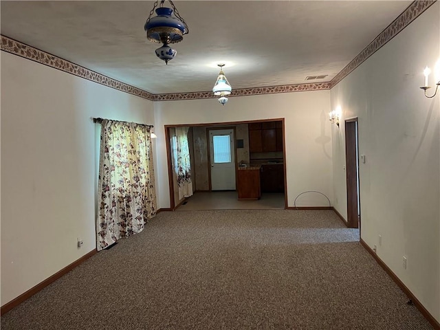 409 S Buckeye St, Iola, KS 66749 - unfurnished room featuring light colored carpet