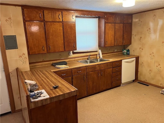 409 S Buckeye St, Iola, KS 66749 - kitchen featuring dishwasher, electric panel, and a textured ceiling