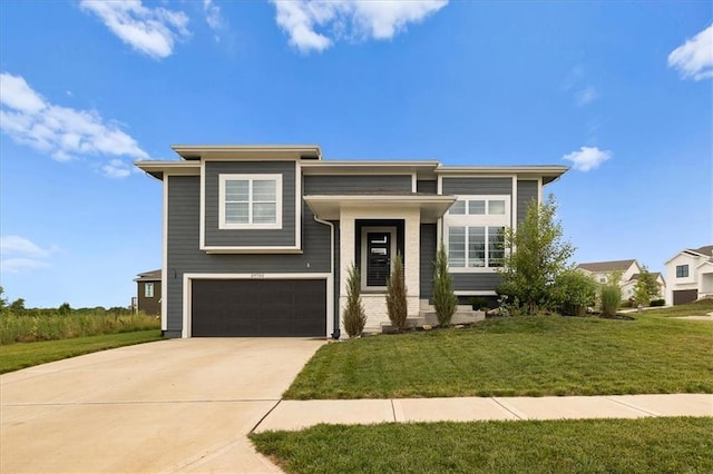 29702 W 195th St, Gardner, KS 66030 - view of front of house featuring a garage, concrete driveway, and a front lawn