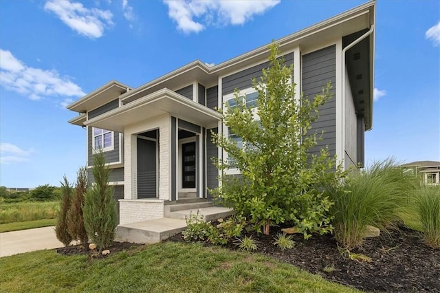 29702 W 195th St, Gardner, KS 66030 - view of property exterior featuring concrete driveway and a lawn