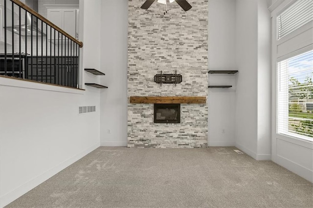 29702 W 195th St, Gardner, KS 66030 - unfurnished living room featuring a high ceiling, a ceiling fan, carpet floors, and healthy amount of natural light