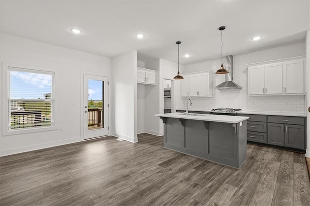 29702 W 195th St, Gardner, KS 66030 - kitchen featuring wall chimney range hood, gray cabinets, dark wood-style flooring, white cabinets, and recessed lighting