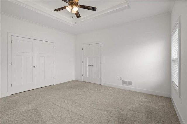 29702 W 195th St, Gardner, KS 66030 - unfurnished bedroom featuring crown molding, carpet floors, a tray ceiling, and a ceiling fan