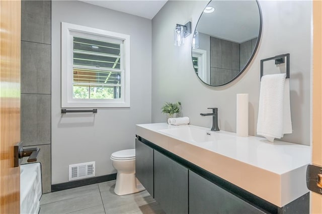 2031 N 75th St, Kansas City, KS 66109 - bathroom with vanity, a bathtub, and tile patterned floors