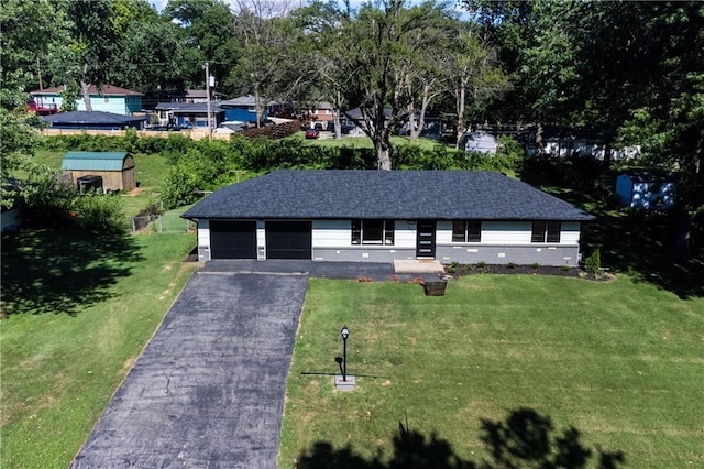 2031 N 75th St, Kansas City, KS 66109 - single story home featuring a front yard, driveway, and view of wooded area