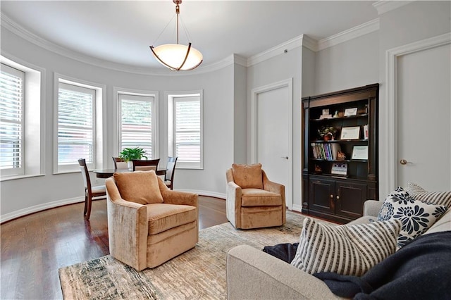 4900 Central St Unit 104, Kansas City, MO 64112 - sitting room featuring plenty of natural light, wood finished floors, and ornamental molding