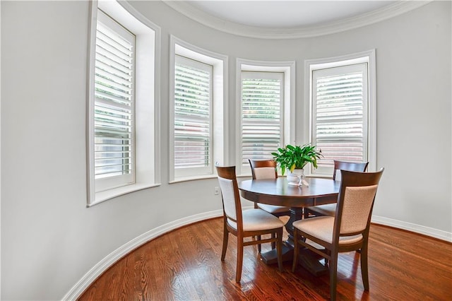 4900 Central St Unit 104, Kansas City, MO 64112 - dining space featuring wood finished floors and crown molding