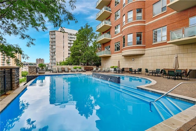 4900 Central St Unit 104, Kansas City, MO 64112 - community pool featuring a patio