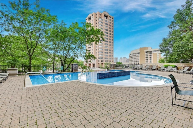 4900 Central St Unit 104, Kansas City, MO 64112 - community pool featuring a patio area