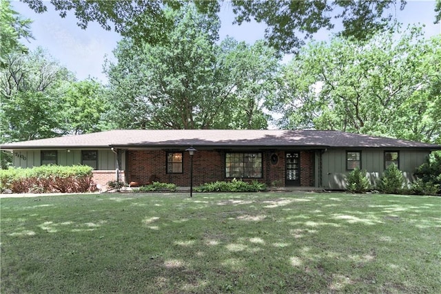7100 Antioch Rd, Merriam, KS 66204 - ranch-style house featuring board and batten siding, a front yard, and brick siding