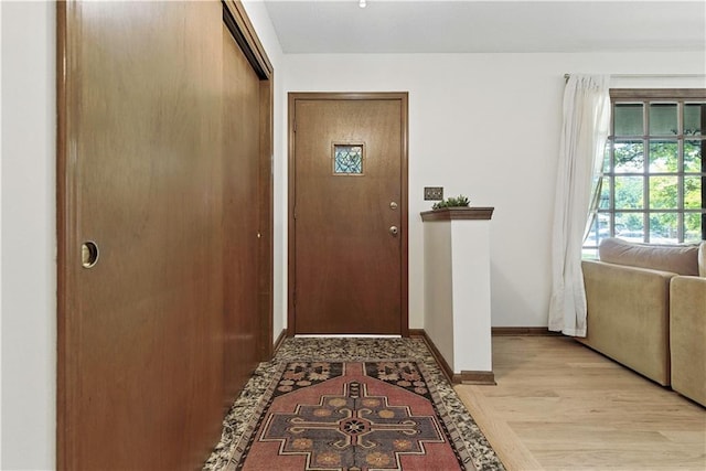 7100 Antioch Rd, Merriam, KS 66204 - doorway to outside with baseboards and light wood-style flooring