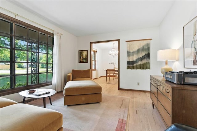 7100 Antioch Rd, Merriam, KS 66204 - living area featuring a chandelier and light wood-type flooring