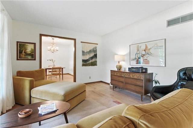 7100 Antioch Rd, Merriam, KS 66204 - living area featuring wood finished floors and a chandelier