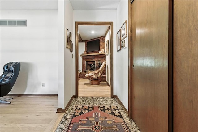 7100 Antioch Rd, Merriam, KS 66204 - corridor featuring light wood-type flooring and baseboards