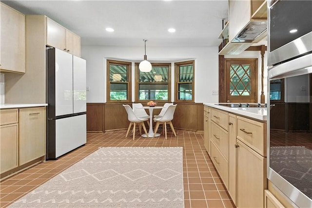 7100 Antioch Rd, Merriam, KS 66204 - kitchen featuring freestanding refrigerator, oven, exhaust hood, wainscoting, and black electric cooktop