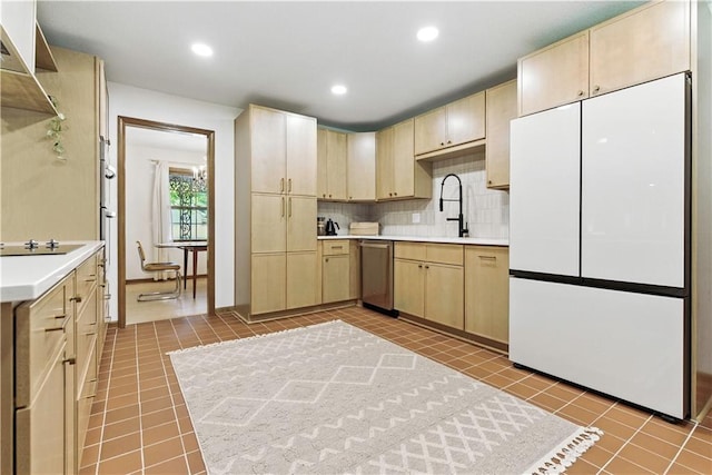 7100 Antioch Rd, Merriam, KS 66204 - kitchen with freestanding refrigerator, light brown cabinetry, light tile patterned flooring, black electric cooktop, and dishwasher