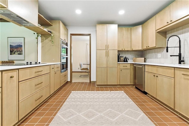 7100 Antioch Rd, Merriam, KS 66204 - kitchen with light brown cabinets, appliances with stainless steel finishes, light countertops, and recessed lighting