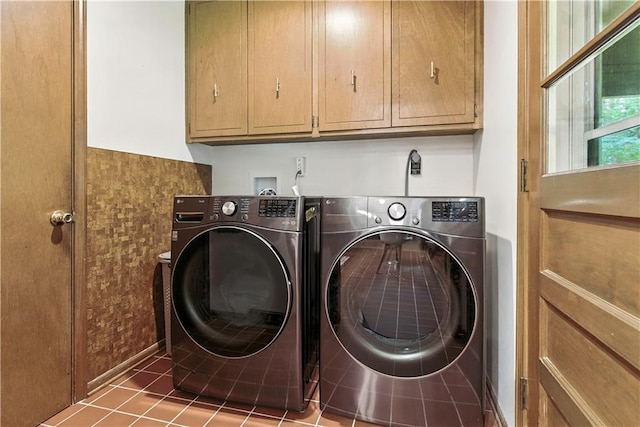 7100 Antioch Rd, Merriam, KS 66204 - washroom featuring separate washer and dryer, cabinet space, and tile patterned floors