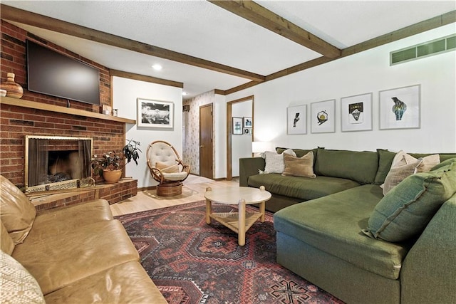 7100 Antioch Rd, Merriam, KS 66204 - living area featuring beamed ceiling, wood finished floors, a brick fireplace, and recessed lighting