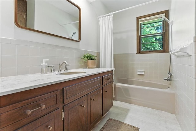 7100 Antioch Rd, Merriam, KS 66204 - full bathroom featuring vanity, tile walls, and shower / bathtub combination with curtain